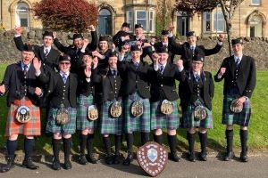 WL Schools Pipe Band Gourock success Members of West Lothian School Pipe Band celebrate first place trophy at Gourock Highland Games