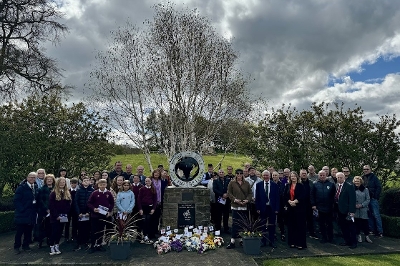 IWMD 2024 group pic Everyone at IWMD 2024 event with the memorial and flowers