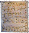 This sampler was sewn by 12 year old girl in December, 1882. It contains alphabet, numbers and the initials of her immediate family. Samplers are pieces of needlework which show a variety of stitches. 