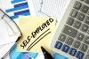 Self Employed Written on Post-it Note