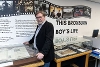 Michael Caton-Jones standing in front of the "This Broxburn Boy's Life" exhibition title.